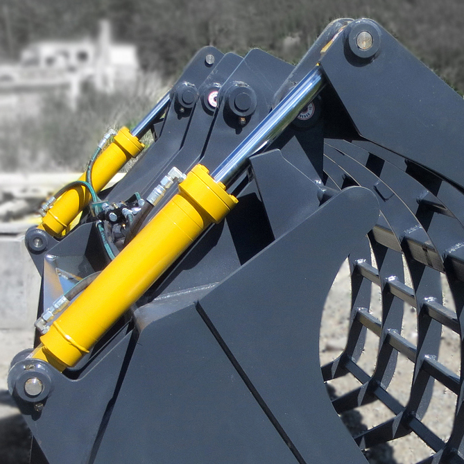 Dual hydraulic cylinders manufactured by Red Raven Hydraulics, installed onto a wheel loader corral bucket